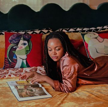 best cheap bed frames girl laying on bed reading a book